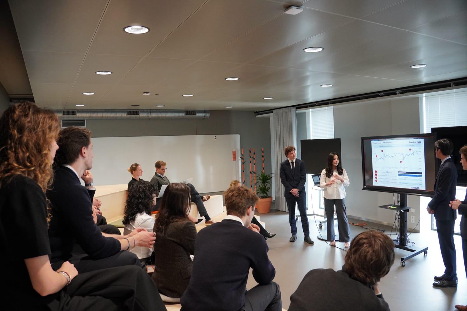 A Prometheus Capital member presenting equity research to a seated audience
